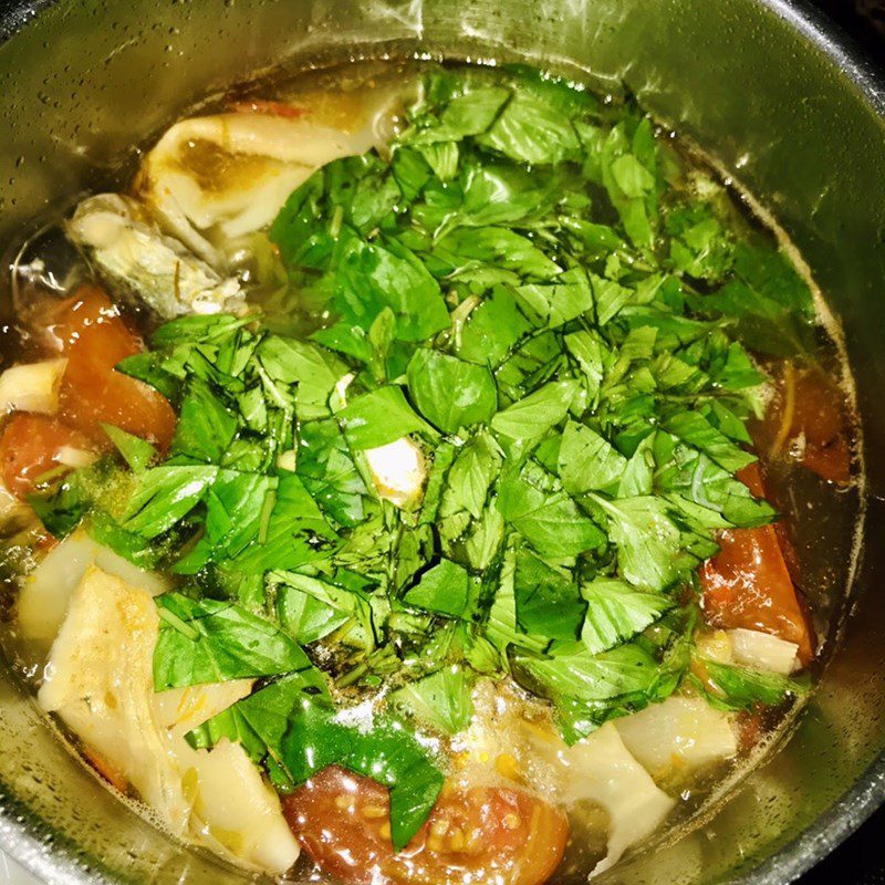 Step 2 Cooking soup Sour bamboo shoot soup with mackerel