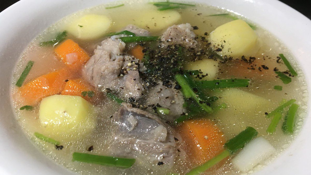 Bone soup with potatoes and carrots