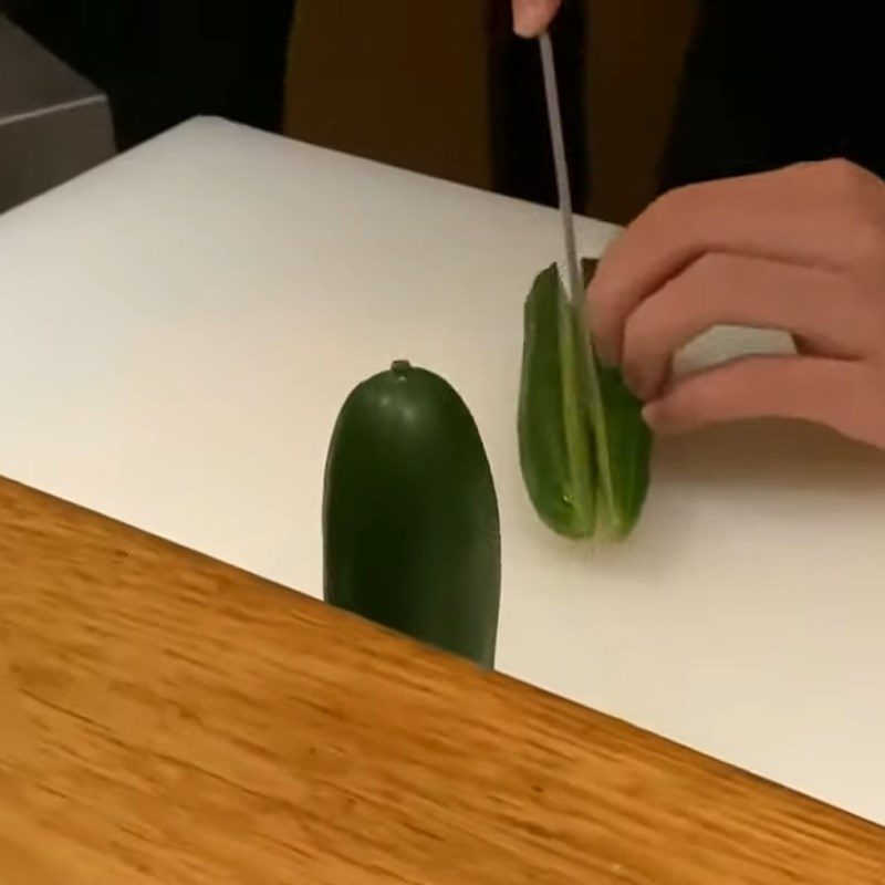 Step 1 Cut the cucumber in half Create a Christmas tree shape from cucumber