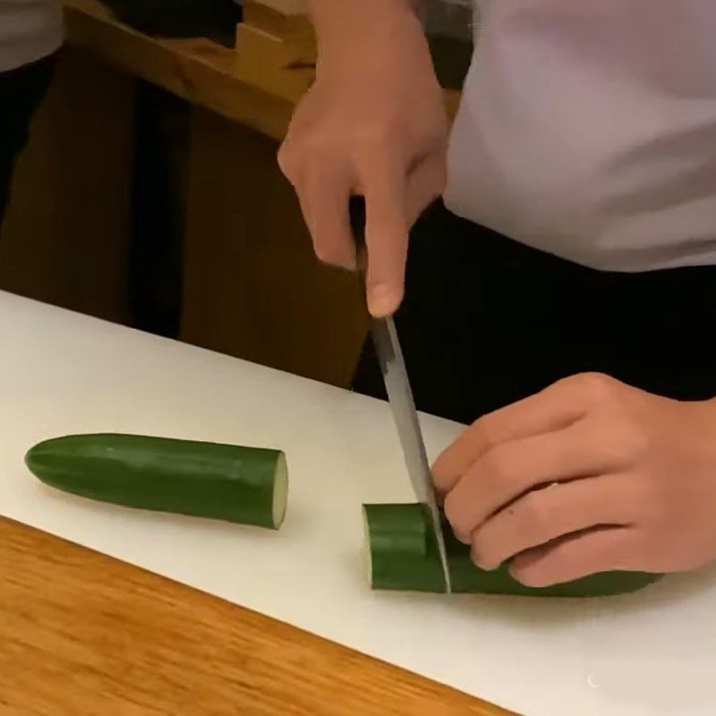 Step 1 Cut the cucumber in half Create a Christmas tree shape from cucumber