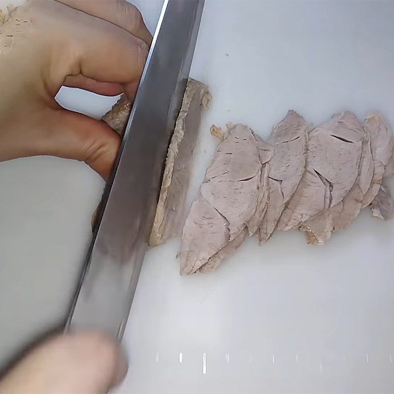 Step 4 Slicing the meat for Hu Tieu Go