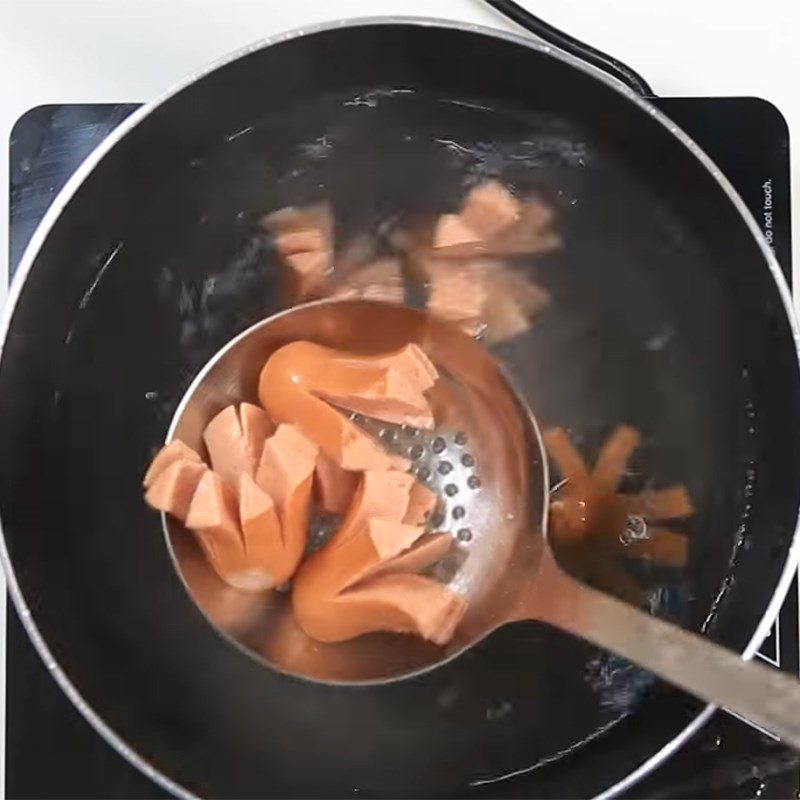 Step 1 Cut and boil the sausages Octopus sausages coated with cheese