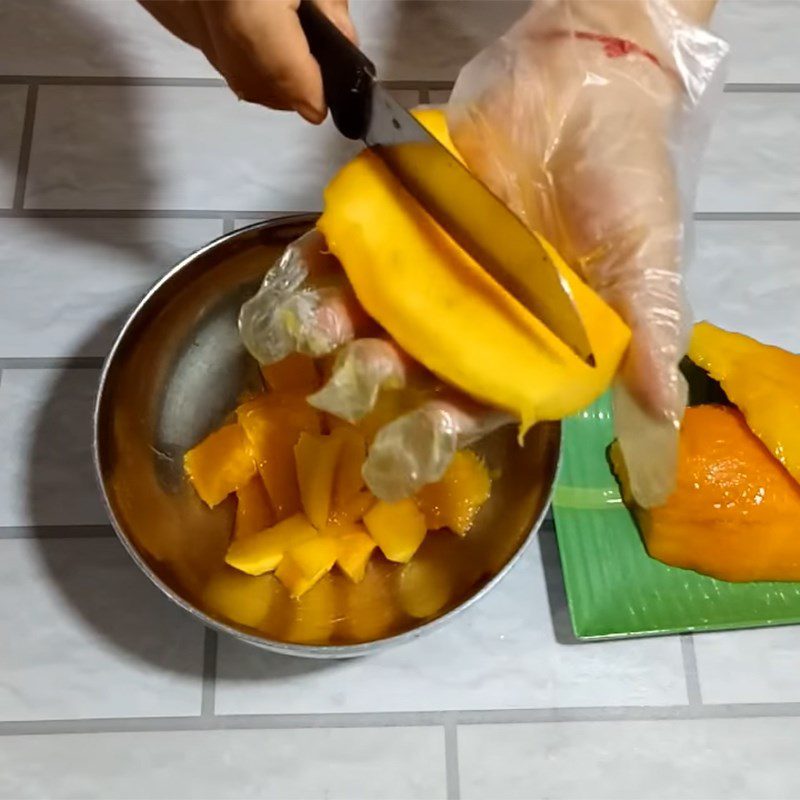 Step 1 Cutting mango Chewy Mango Cake