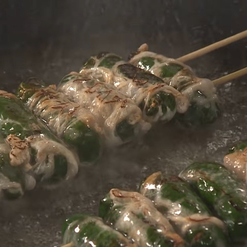 Step 5 Frying frog Frog wrapped in wild betel leaves