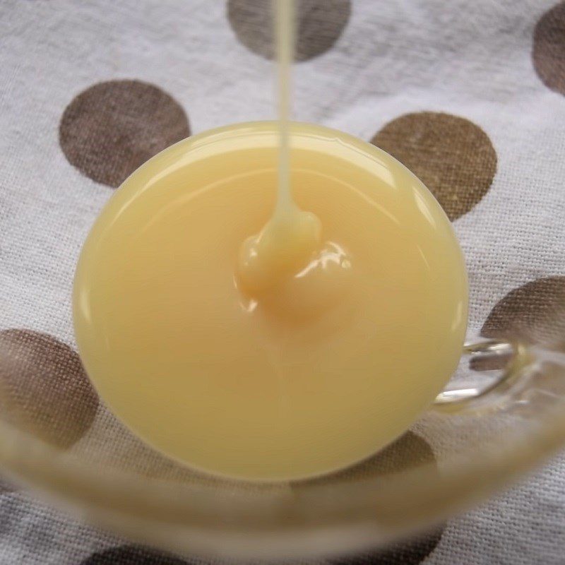 Step 1 Add condensed milk to the cup for hot milk coffee