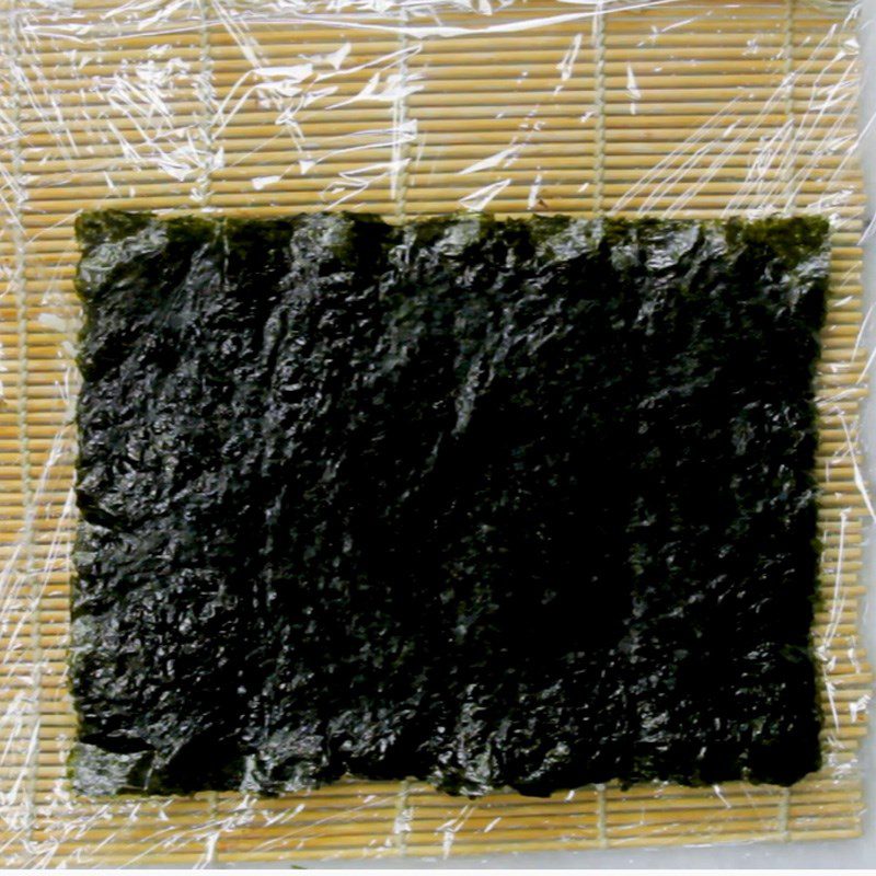 Step 3 Place rice on the seaweed leaf Sushi crab stick