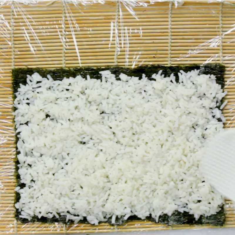 Step 3 Place rice on the seaweed leaf Sushi crab stick