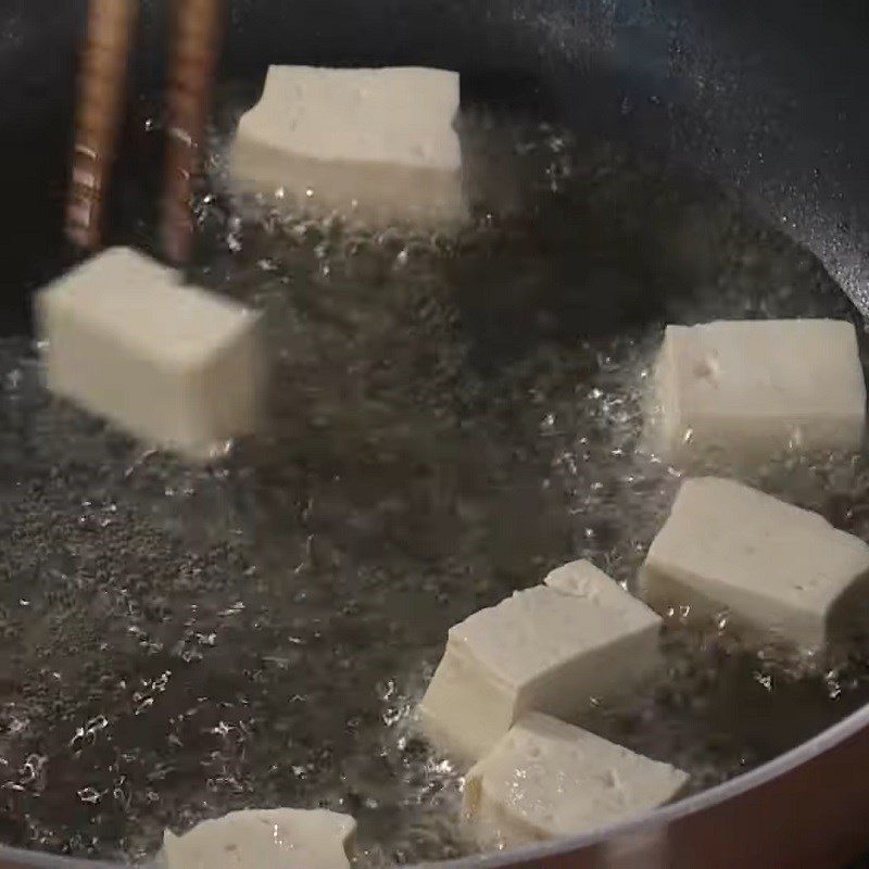 Step 2 Fry the tofu Brown rice with lotus seeds