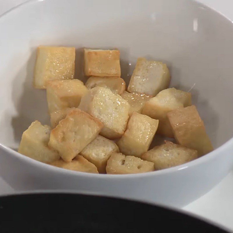 Step 2 Fry the tofu Brown rice with lotus seeds