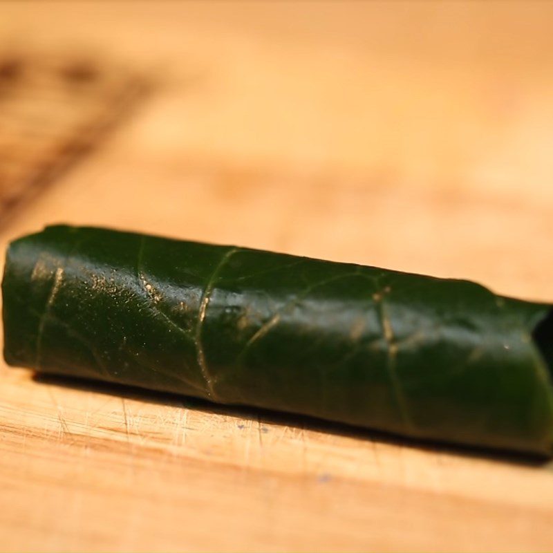 Step 2 Shaping the roll Snakehead fish wrapped in betel leaves