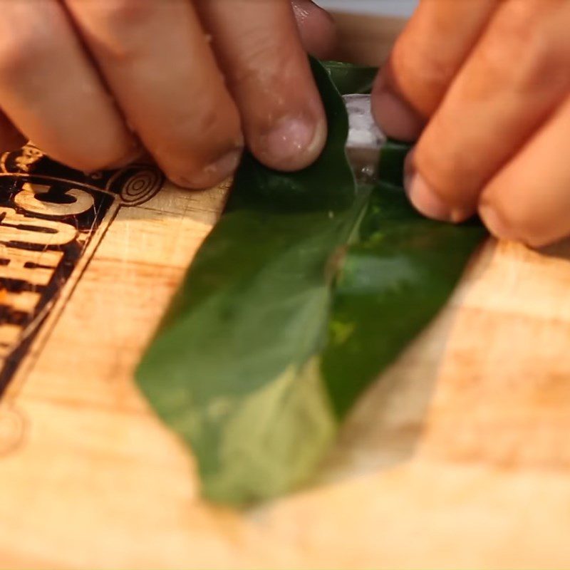 Step 2 Shaping the roll Snakehead fish wrapped in betel leaves