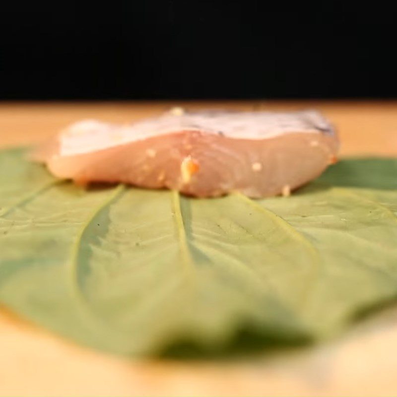 Step 2 Shaping the roll Snakehead fish wrapped in betel leaves