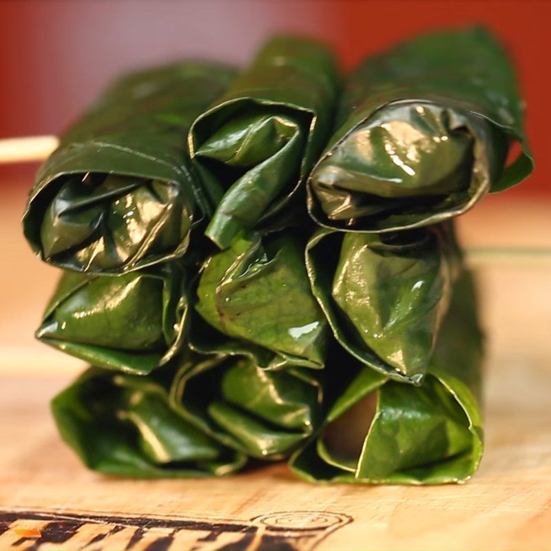 Step 2 Shaping the roll Snakehead fish wrapped in betel leaves