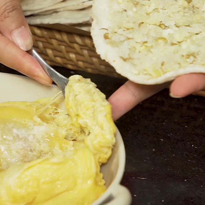 Step 5 Wrapping sticky rice with rice paper and durian Sticky rice roll with durian