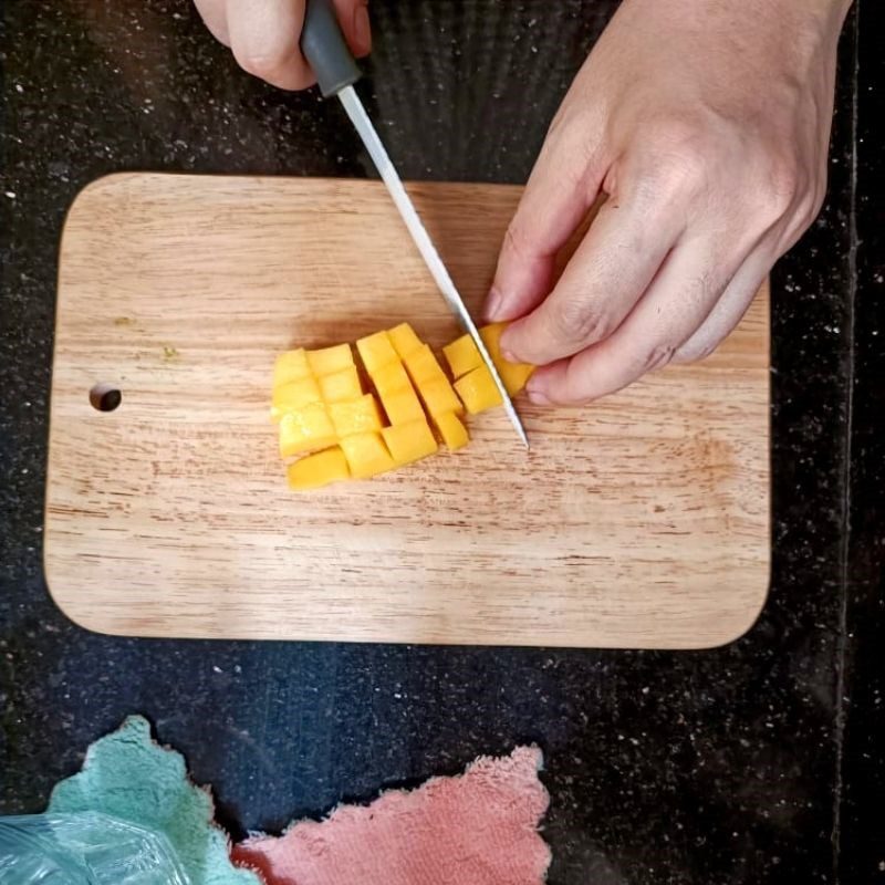 Step 1 Mash the mango Fresh milk mango salad