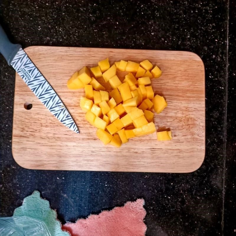 Step 1 Mash the mango Fresh milk mango salad