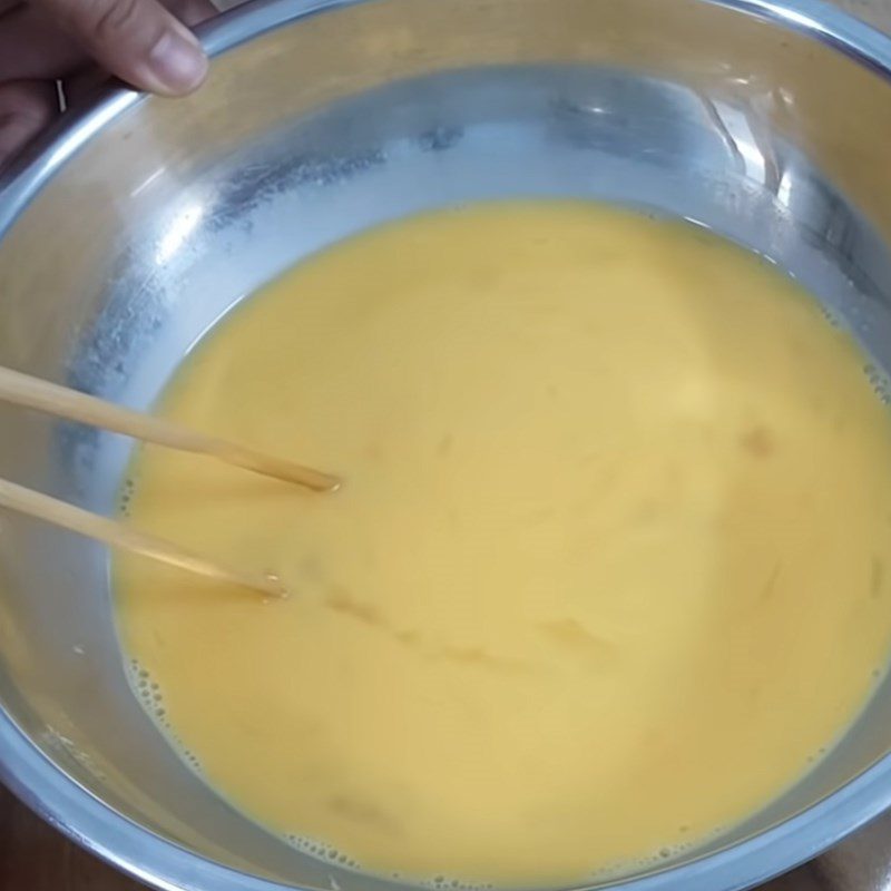 Step 2 Whisking eggs and mixing condensed milk for condensed milk flan