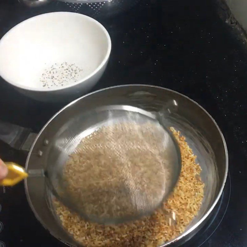 Step 2 Stirring Rice with Sugar for Dried Rice with Black Sesame Sugar