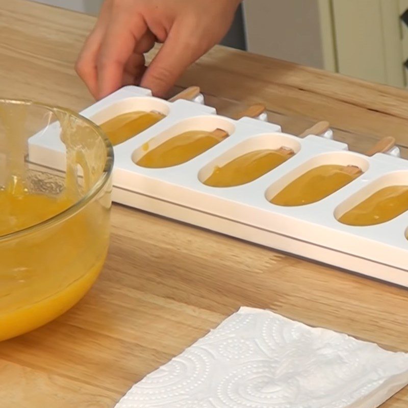 Step 1 Pour into molds and freeze the mango sauce Thai Mango Sticky Rice Ice Cream