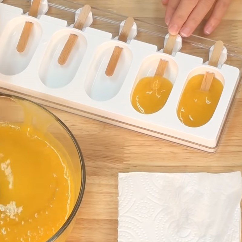 Step 1 Pour into molds and freeze the mango sauce Thai Mango Sticky Rice Ice Cream