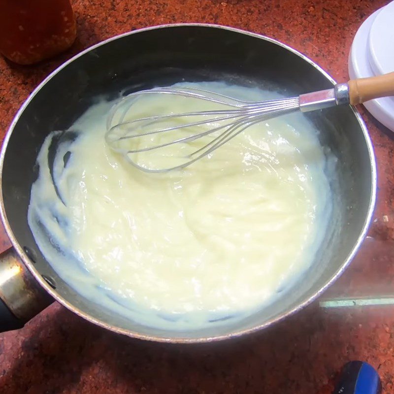 Step 2 Heat the milk for Doraemon cake with egg, milk, and cheese filling