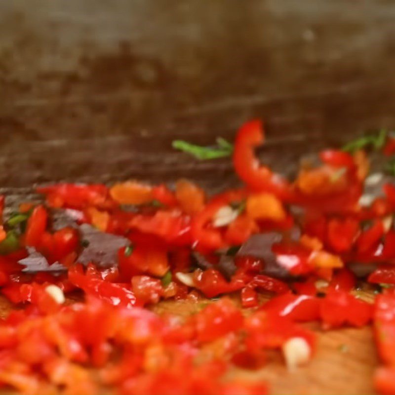 Step 1 Pounding the Marinade Mixture for the Fish Grilled Pa Pỉnh Tộp Using Charcoal Stove