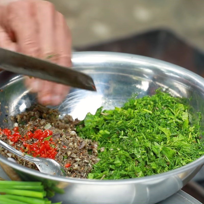 Step 1 Pounding the Marinade Mixture for the Fish Grilled Pa Pỉnh Tộp Using Charcoal Stove