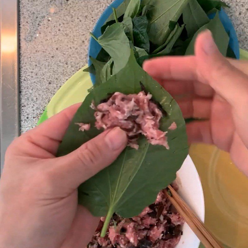 Step 3 Wrap the meat for Grilled Pork with Betel Leaves