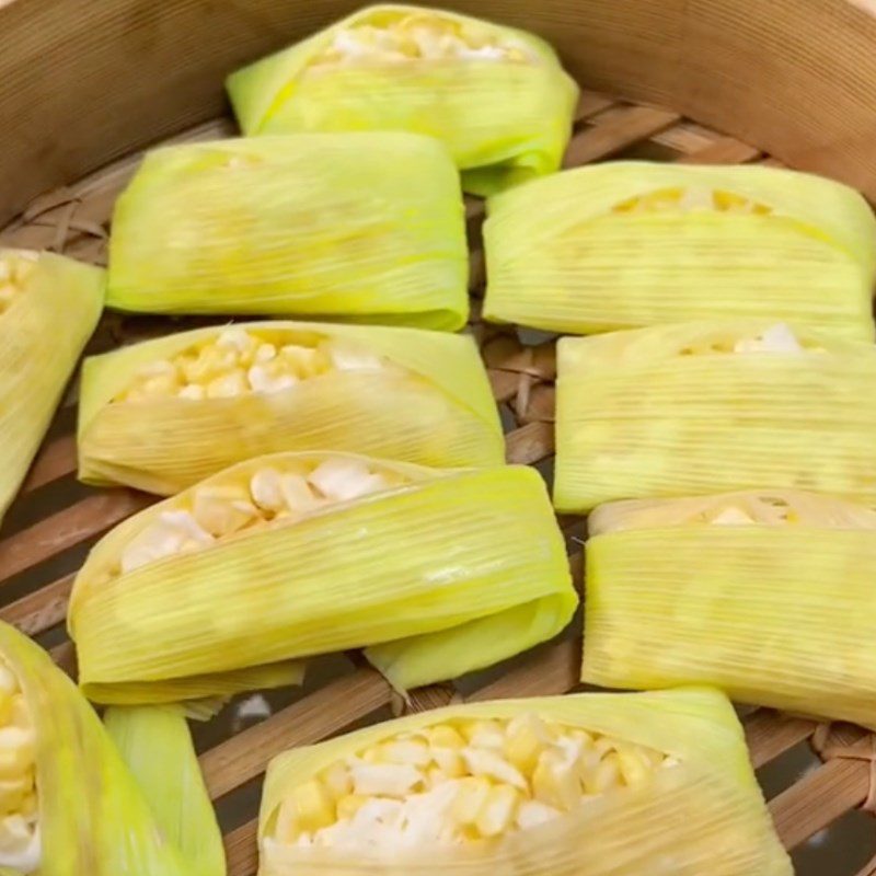 Step 3 Wrapping and steaming the cake Corn cake with coconut strands (Recipe from the TikTok channel Cooking with TasteVN)