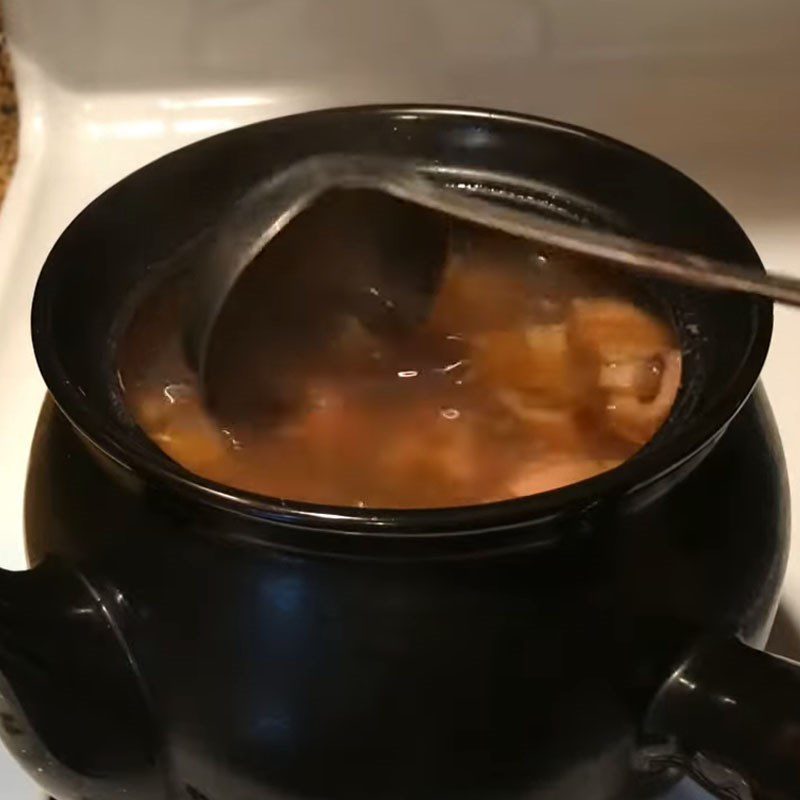 Step 3 Simmer lotus root with beef bones Lotus root soup with beef bones