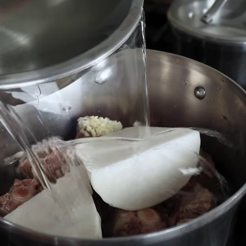 Step 2 Simmer the oxtail with radish Korean oxtail soup