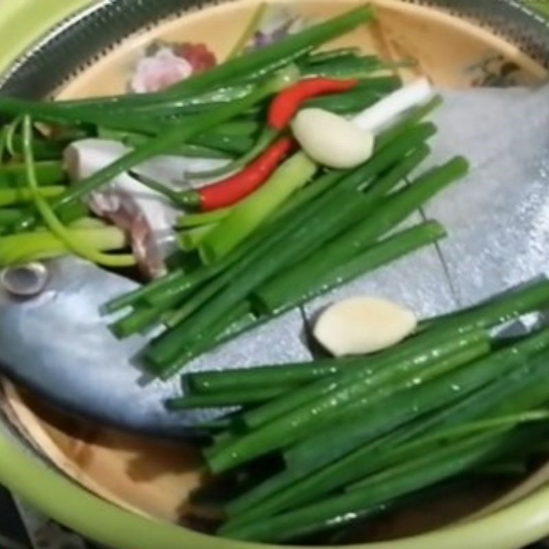 Step 3 Steaming the fish Salted pomfret with green onions