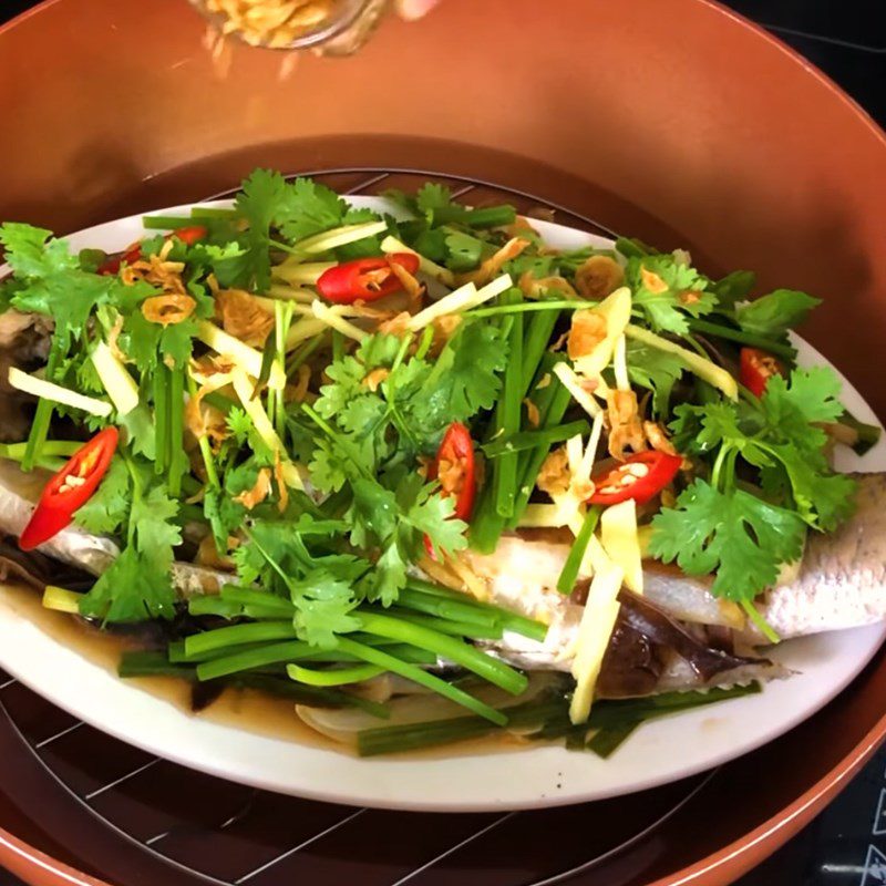 Step 4 Steaming the fish Steamed barramundi with green onion and ginger