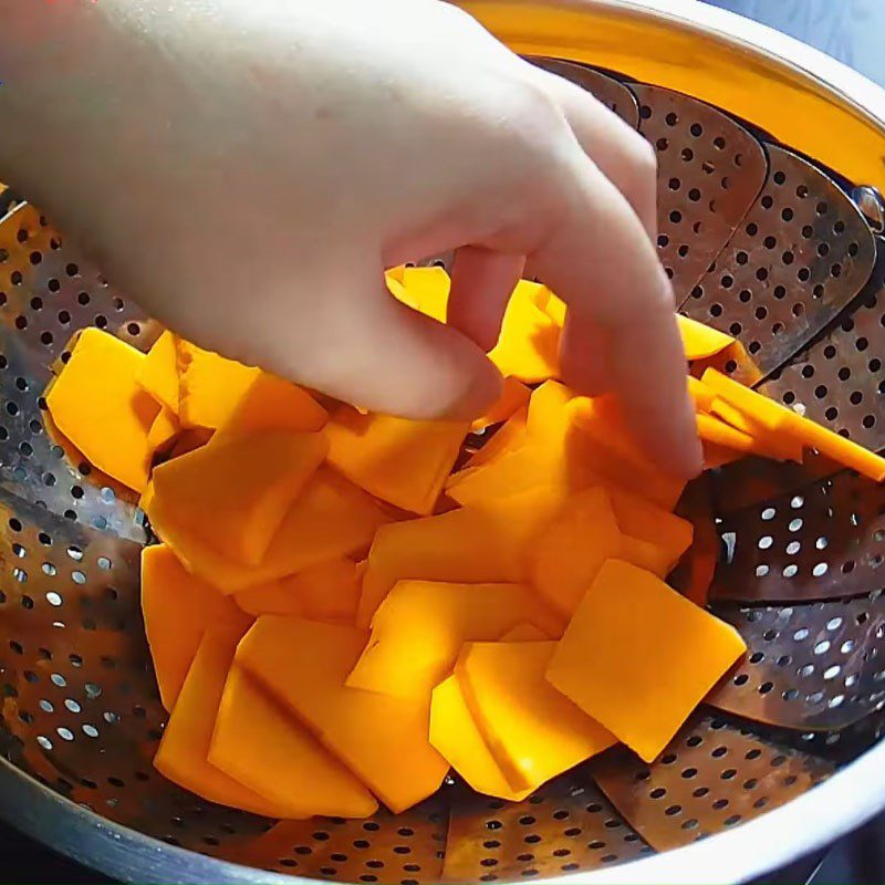 Step 1 Steam and mash the pumpkin Steamed Pumpkin Cake Rolled in Coconut