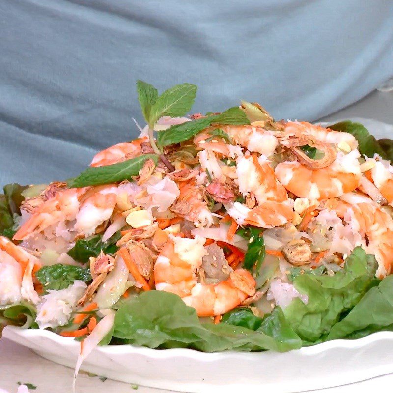 Step 4 Complete the dish Snow mushroom salad with shrimp, pork, and lotus stem