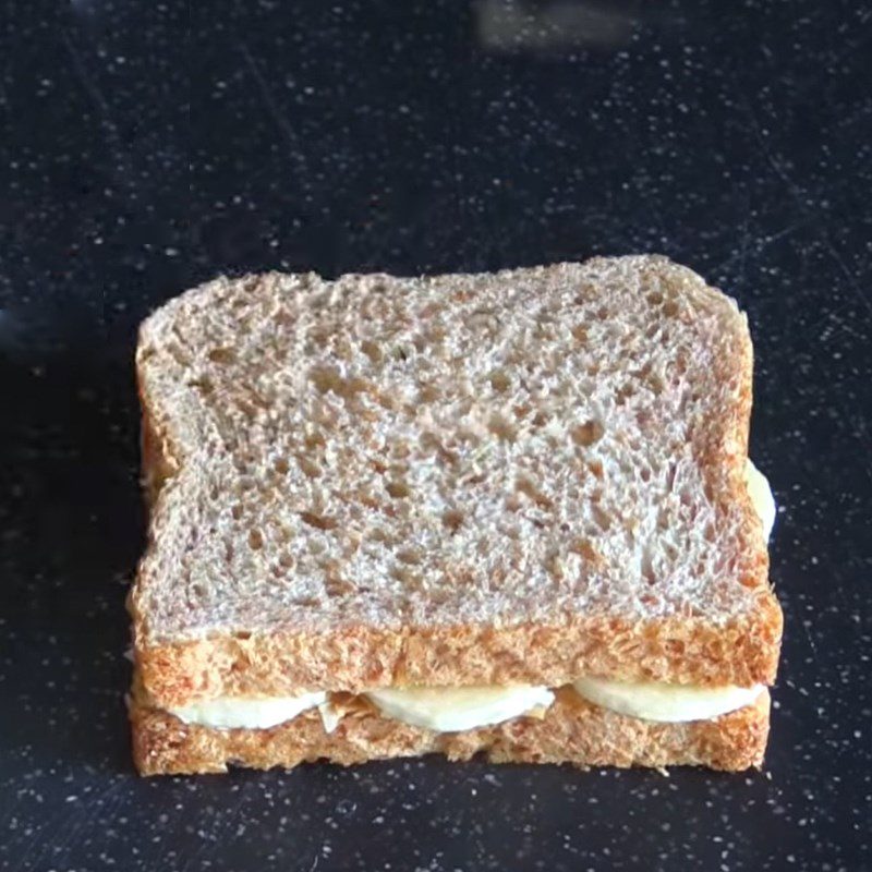 Step 2 Assemble the banana in the bread for Banana Sandwich using a non-stick pan