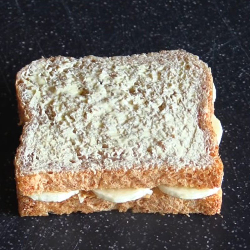 Step 2 Assemble the banana in the bread for Banana Sandwich using a non-stick pan