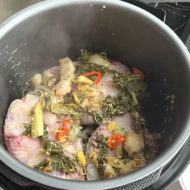 Step 4 Cooking Fish Carp braised with pickled mustard greens using an electric pressure cooker