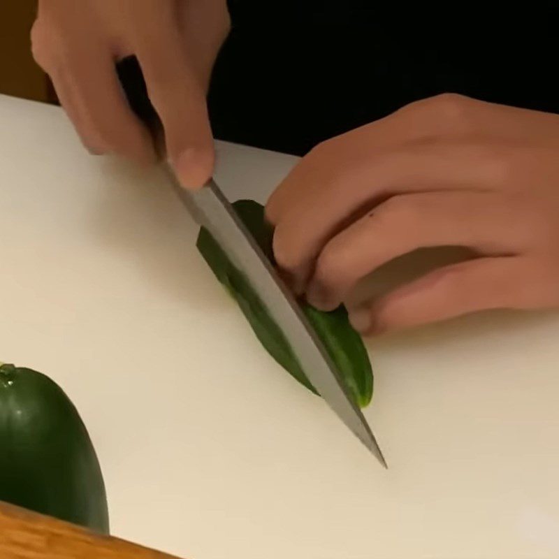 Step 2 Make small cuts in the cucumber Create a Christmas tree shape from cucumber