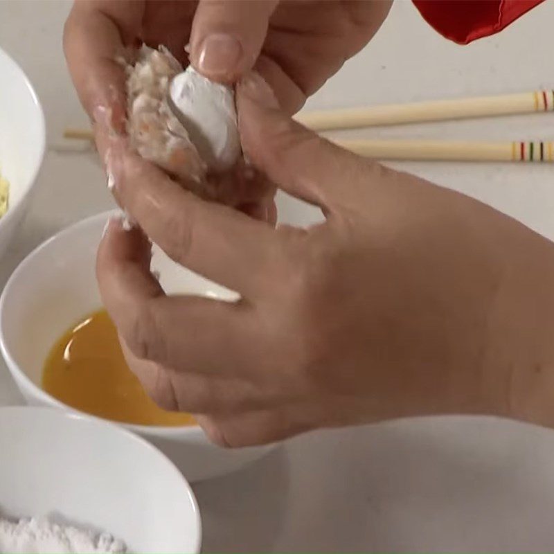 Step 4 Make egg-wrapped fish balls Fried quail egg fish balls with sesame