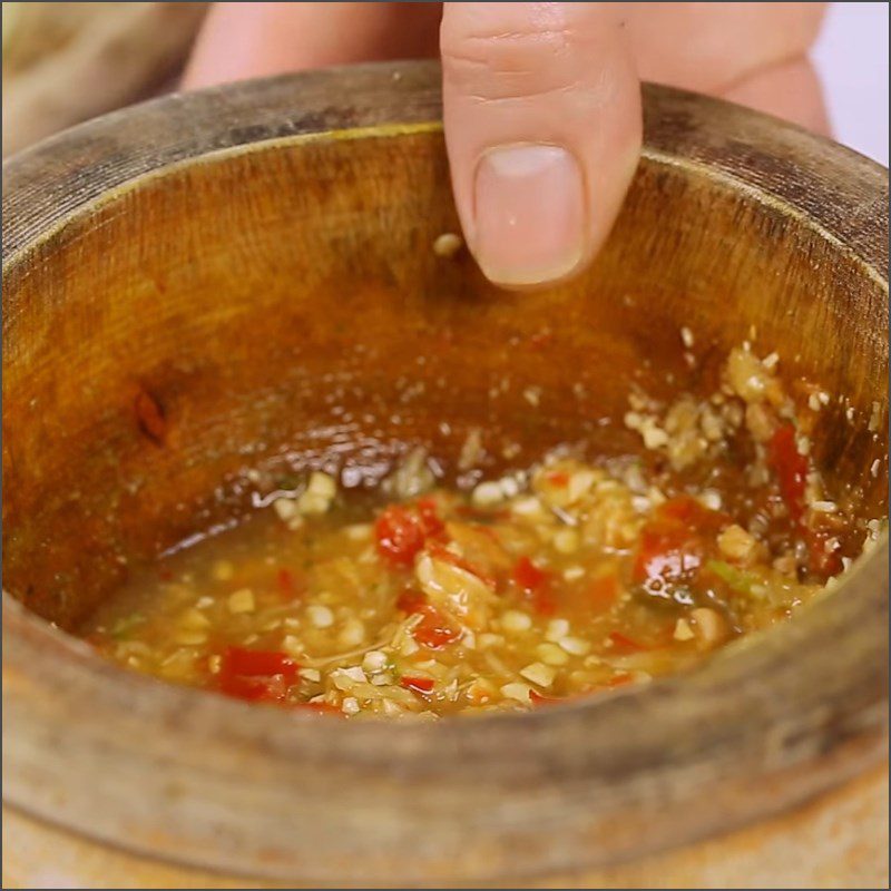 Step 2 Making dipping sauce Garlic chili dipping sauce with coriander roots and peanuts