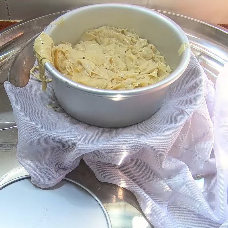 Step 3 Filter and press the tofu skin