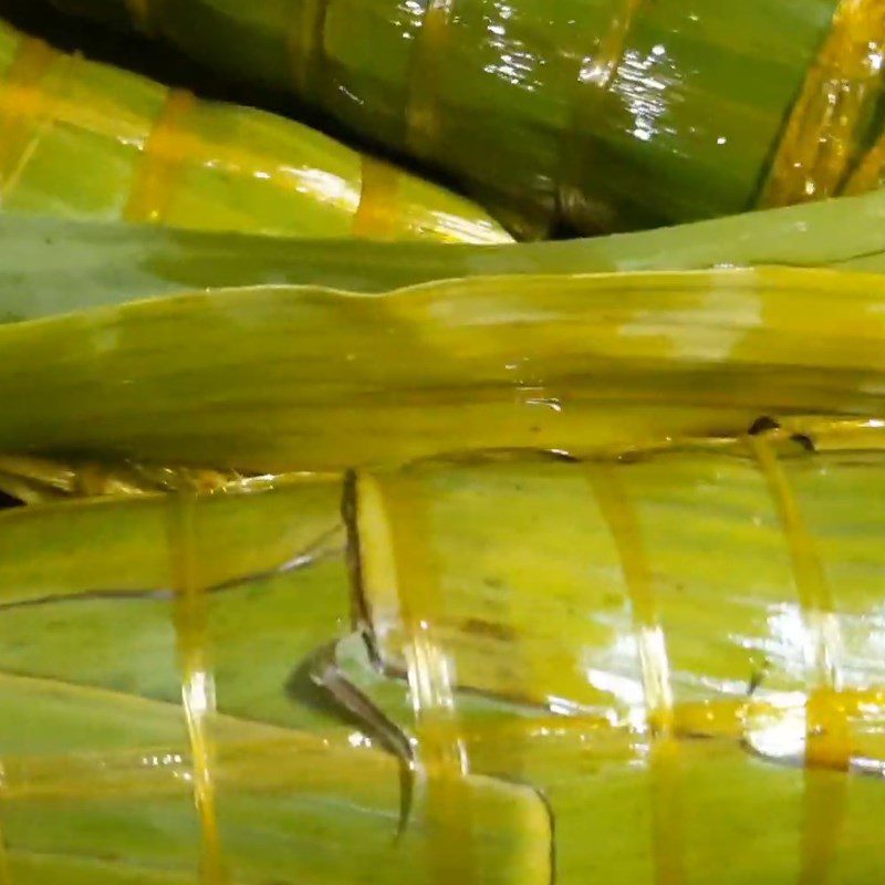 Step 8 Boiling the Gấc Sticky Rice Cake