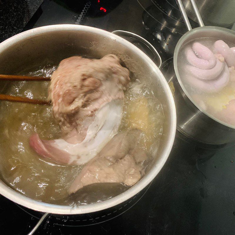 Step 2 Boil the meat, tongue, and pig's entrails Bun dau mam tom