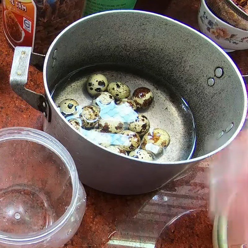 Step 2 Boil and peel the quail eggs for red rice paper wrapped quail eggs