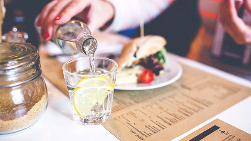 Alternate alcoholic drinks with water and eat food