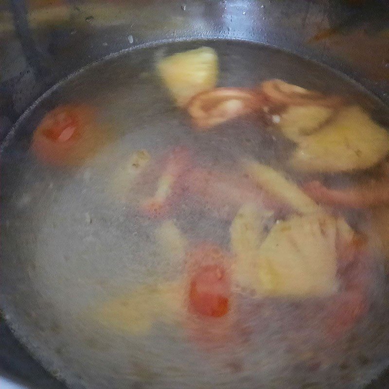 Step 2 Cook tomatoes with pineapple Sardine noodle soup with fish cake