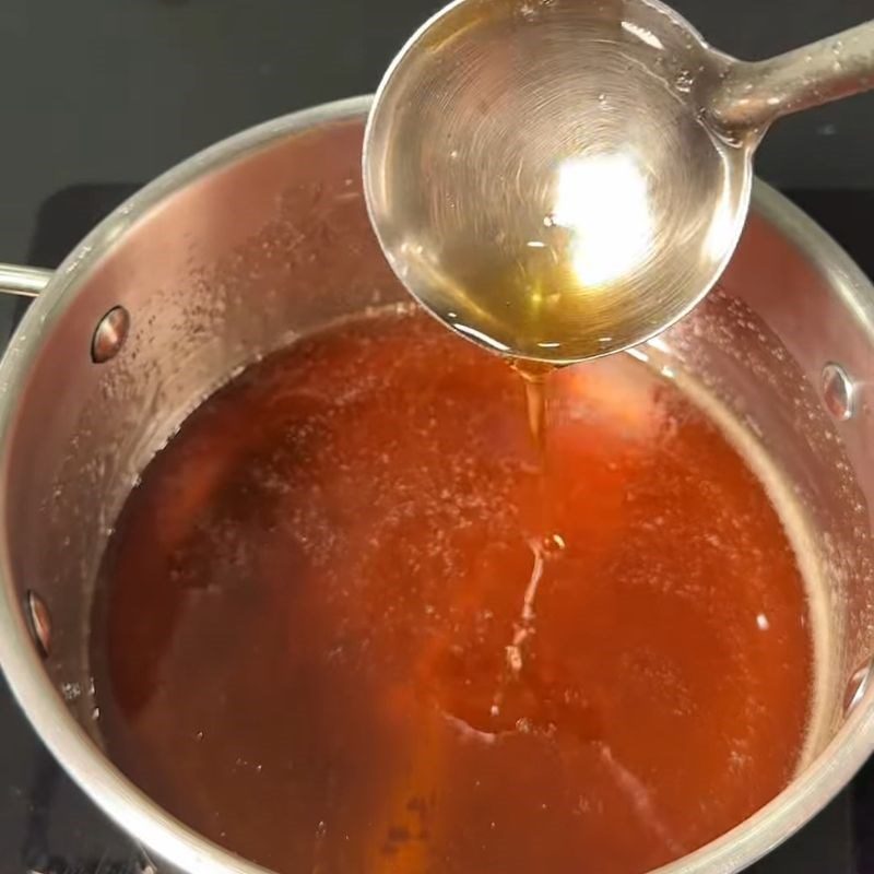 Step 1 Cook rock sugar with fish sauce Gỏi chả lụa