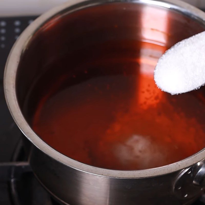 Step 2 Cook the mixture of Soda and vegetarian fish sauce from pineapple and soda