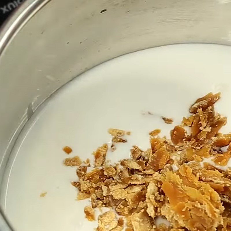 Step 2 Cook coconut milk for mung bean and coconut sticky rice cake